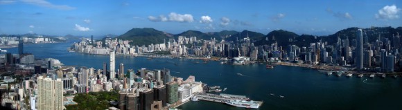 Picture: “Hong Kong Victoria Harbour Pano View from ICC 201105” by WiNG – Own work. Licensed under CC BY-SA 3.0 via Wikimedia Commons.